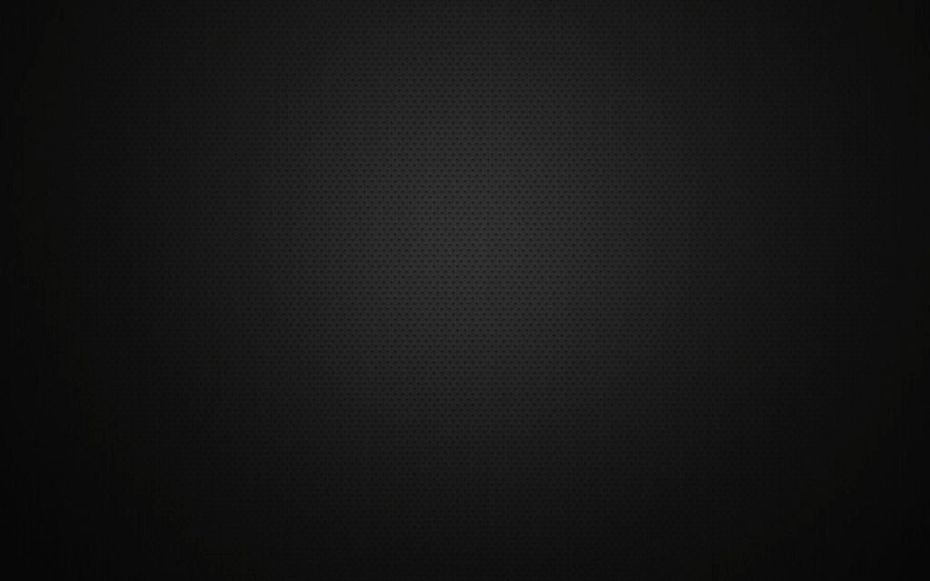 Black textured background featuring a subtle dotted pattern ideal for design purposes.